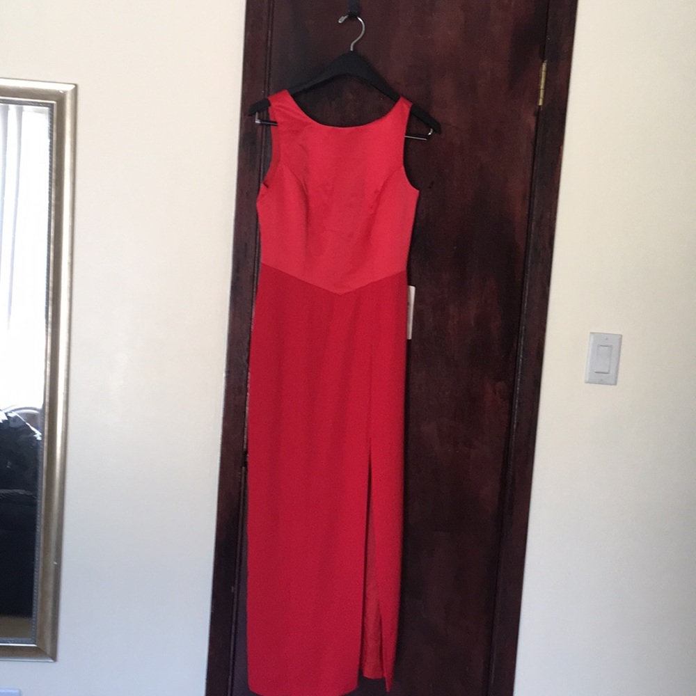 low cut in back with side slit in front. Size:S